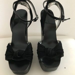 Bebe black wedge leather high platform wood base.